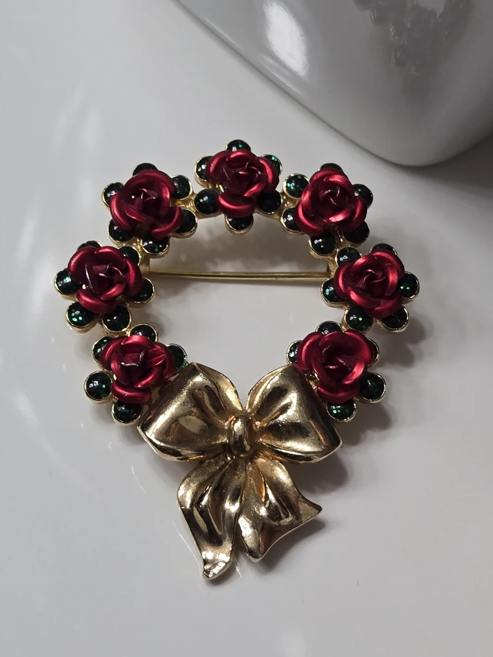 Avon Gold Bow Wreath Brooch with Red Roses and Green Accents